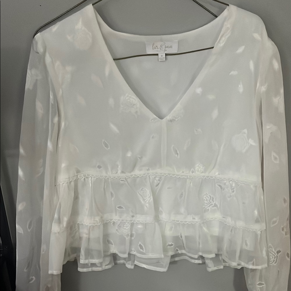 Cream Peplum Blouse with Long Sleeves and Ruffles